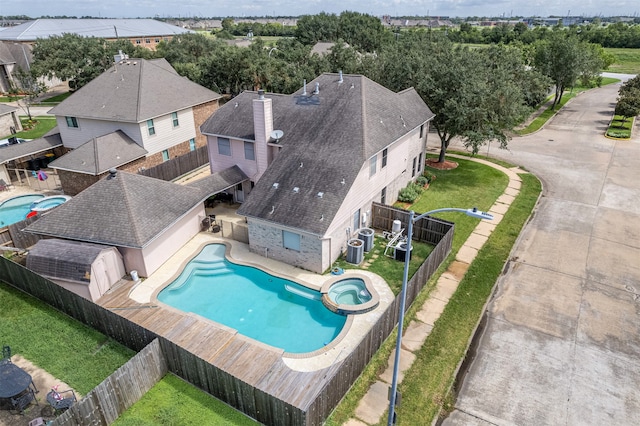 view of swimming pool featuring a lawn and a patio