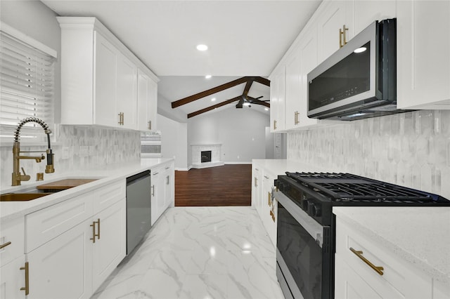 kitchen with black gas stove, sink, dishwasher, and white cabinets