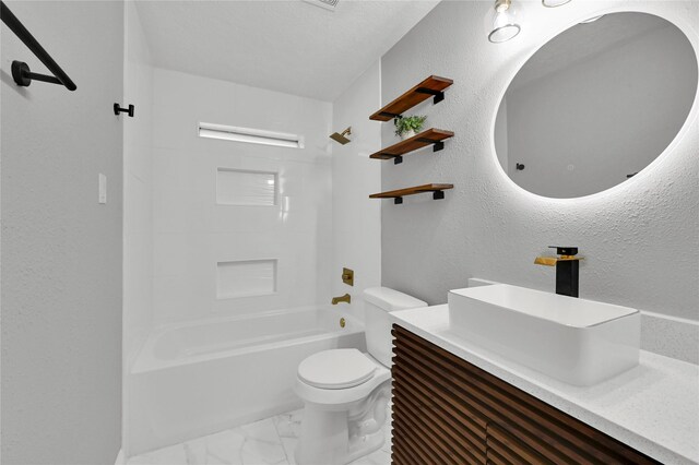 full bathroom featuring toilet, vanity, and shower / bathtub combination