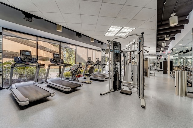 workout area with a drop ceiling