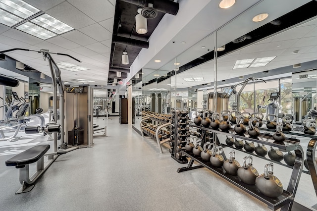 workout area featuring a paneled ceiling