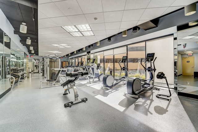 exercise room with a drop ceiling