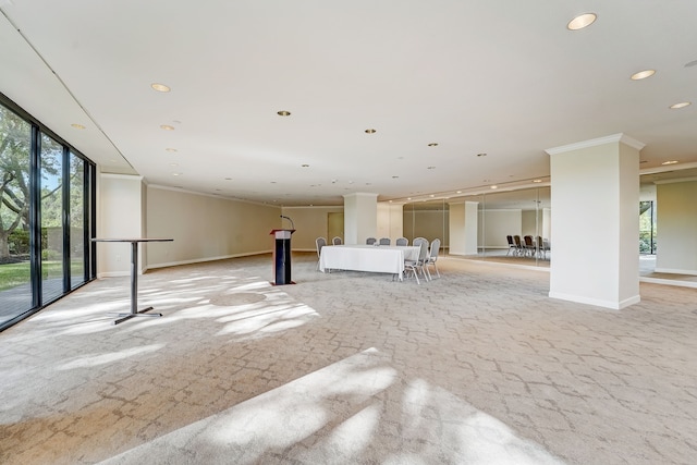 unfurnished living room with ornamental molding, recessed lighting, and baseboards