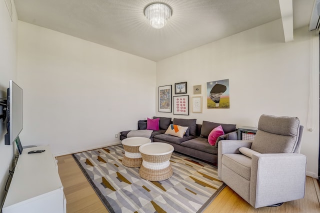 living area with light wood finished floors and baseboards