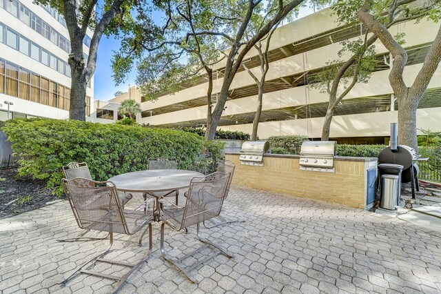 view of patio / terrace featuring outdoor dining area, grilling area, and area for grilling