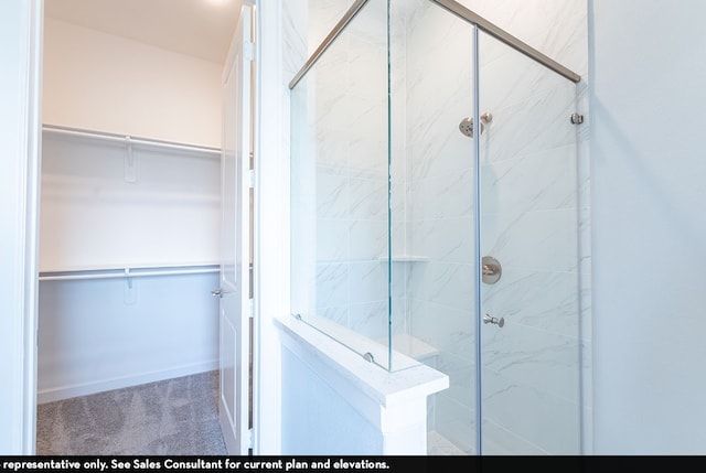 bathroom featuring an enclosed shower