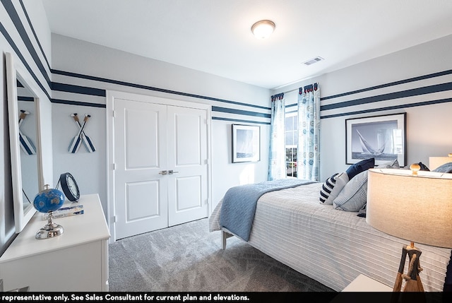 carpeted bedroom with a closet