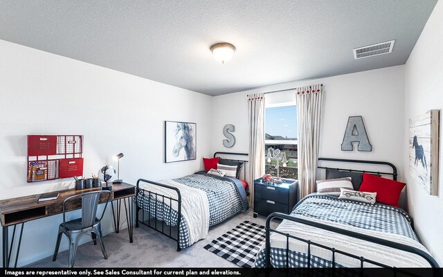 bedroom with light carpet and a textured ceiling