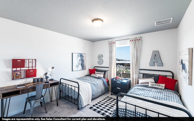 carpeted bedroom featuring a textured ceiling