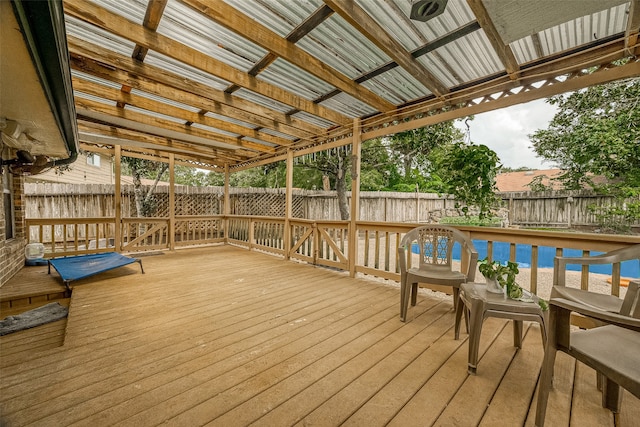 wooden terrace featuring a pool