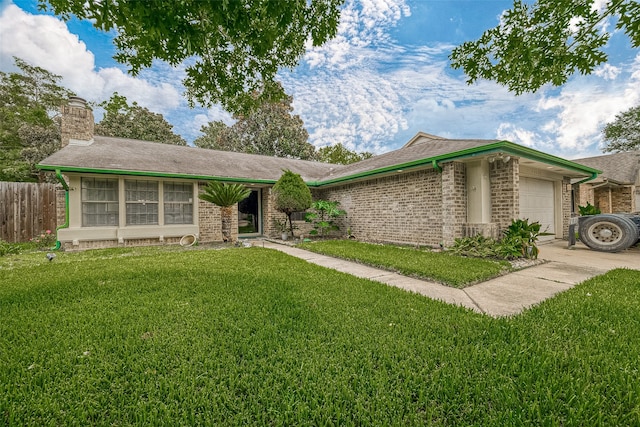 single story home featuring a garage and a front yard