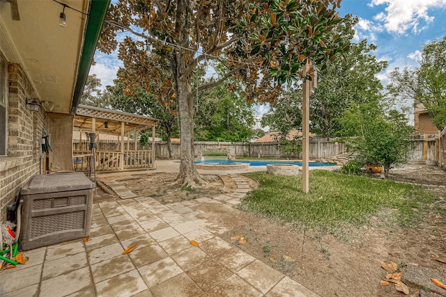 view of yard featuring a patio area and a fenced in pool