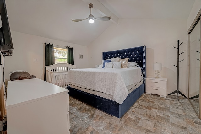 bedroom with vaulted ceiling with beams, a closet, light tile patterned floors, and ceiling fan