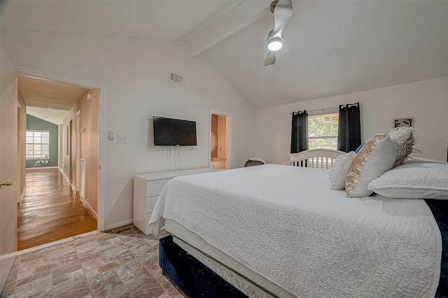 bedroom with vaulted ceiling with beams, ensuite bathroom, light wood-type flooring, and ceiling fan