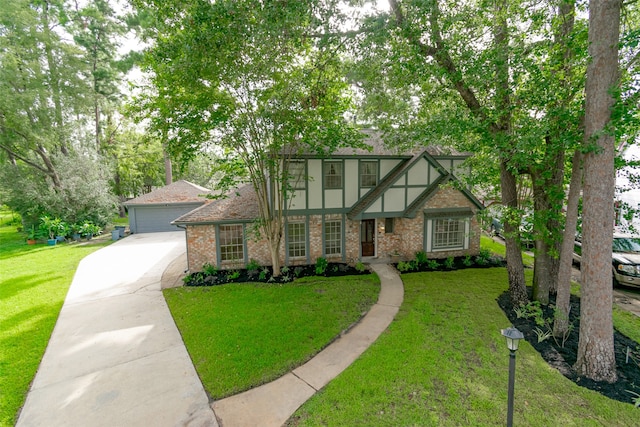 english style home featuring a front lawn