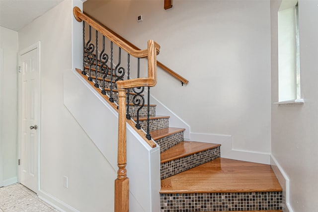 stairs with tile patterned flooring