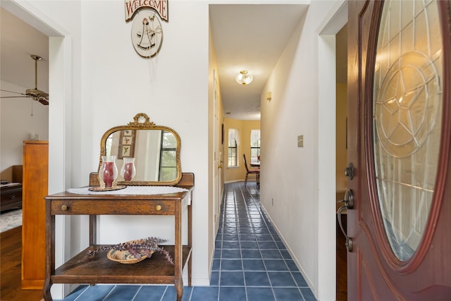 corridor with dark tile patterned flooring