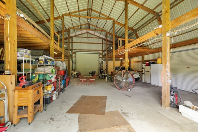 garage featuring white fridge