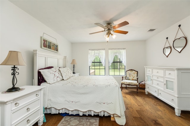 bedroom featuring dark hardwood / wood-style flooring and ceiling fan