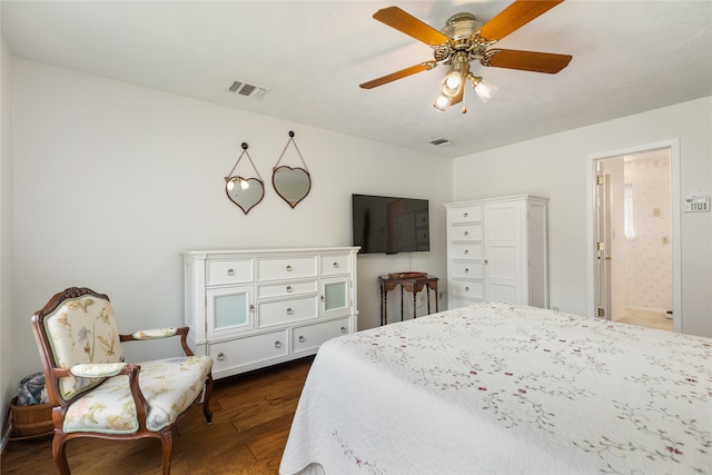 bedroom with connected bathroom, ceiling fan, and dark hardwood / wood-style floors