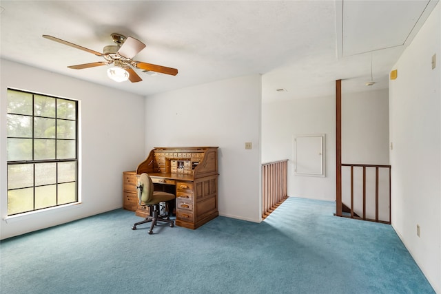 carpeted office with ceiling fan and plenty of natural light