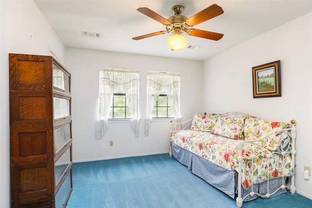 interior space with ceiling fan