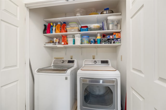 clothes washing area featuring independent washer and dryer