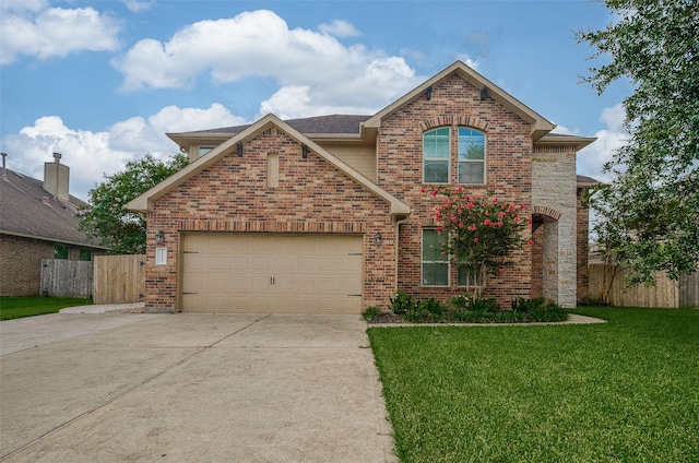 view of front property featuring a garage and a front lawn