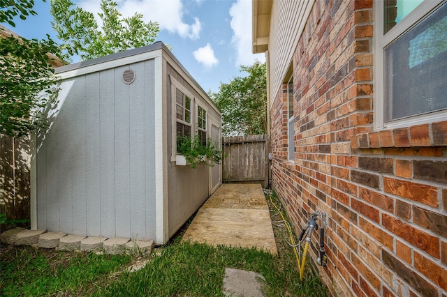 view of property exterior featuring a storage unit