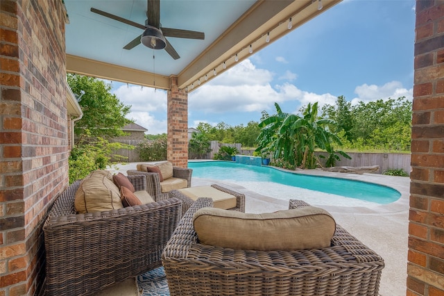 view of pool featuring ceiling fan and a patio