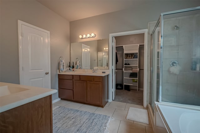 bathroom with vanity, tile patterned floors, and plus walk in shower