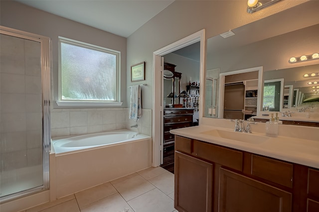 bathroom featuring vanity, separate shower and tub, and tile patterned floors