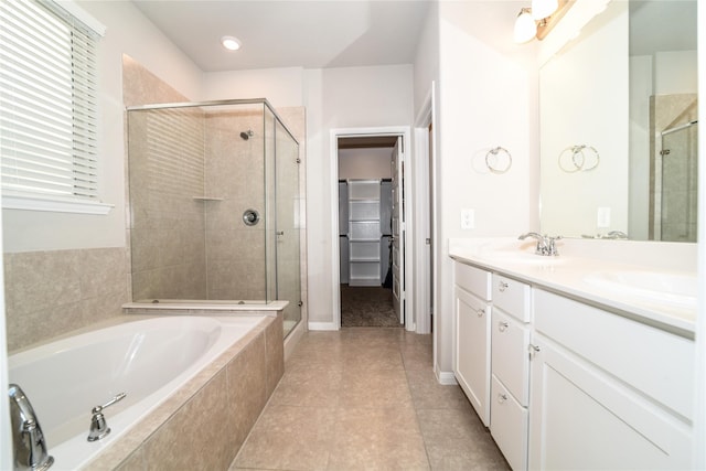 bathroom with vanity, tile patterned floors, and shower with separate bathtub