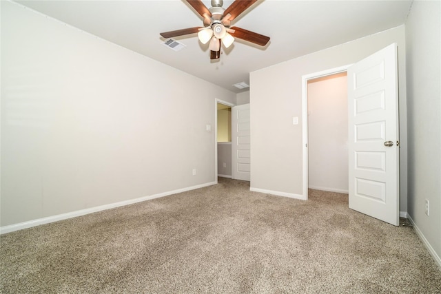 unfurnished bedroom featuring carpet floors and ceiling fan