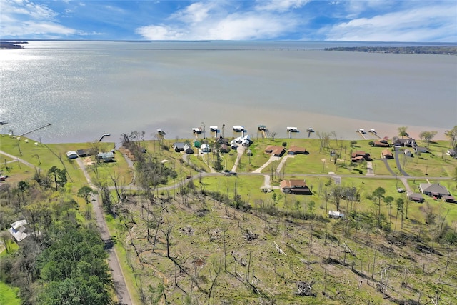 birds eye view of property featuring a water view