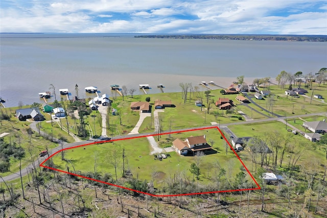 birds eye view of property featuring a water view