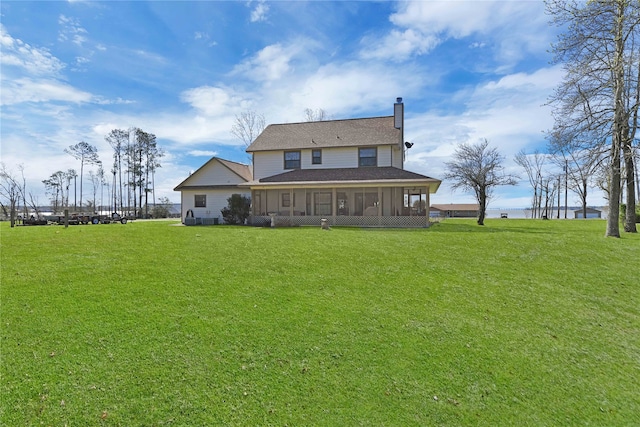 back of house featuring a yard