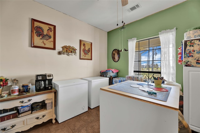 clothes washing area with tile patterned flooring and washer and dryer