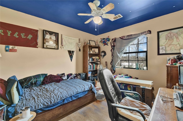 bedroom featuring ceiling fan and light hardwood / wood-style floors