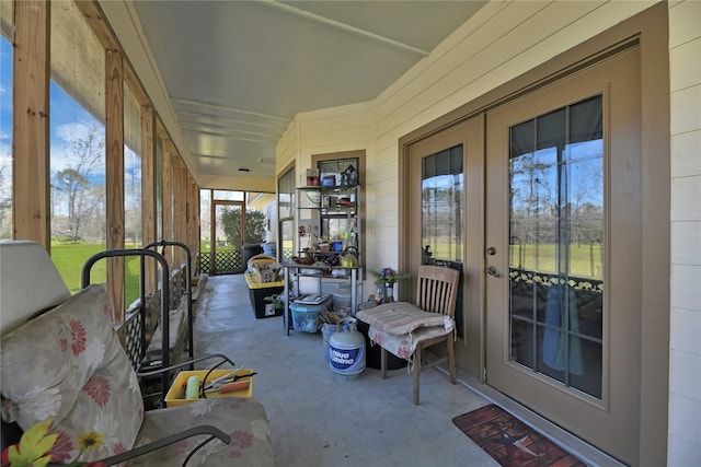 sunroom / solarium featuring french doors