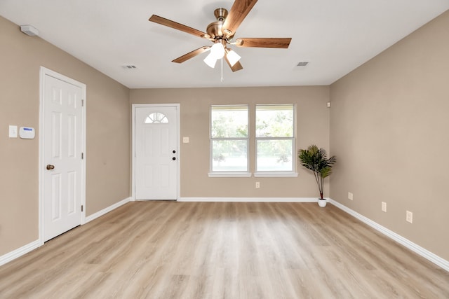 foyer entrance with light hardwood / wood-style flooring and ceiling fan