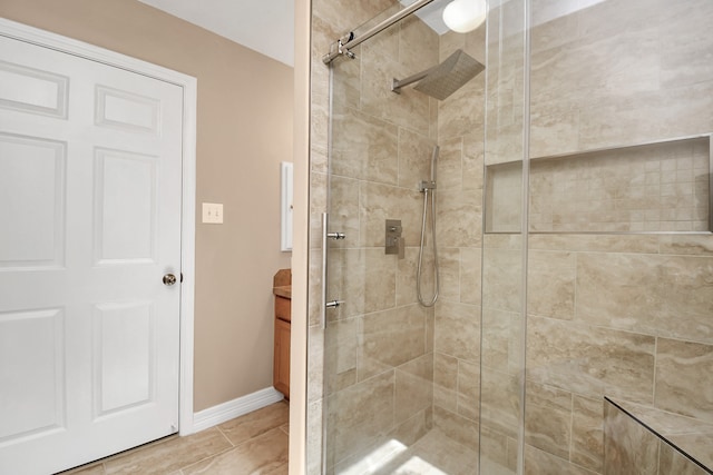 bathroom featuring a tile shower and tile patterned floors