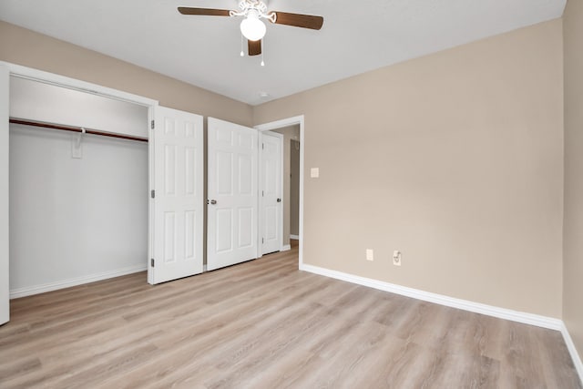 unfurnished bedroom featuring ceiling fan and light hardwood / wood-style flooring