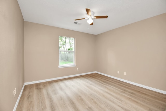 spare room with ceiling fan and light hardwood / wood-style flooring