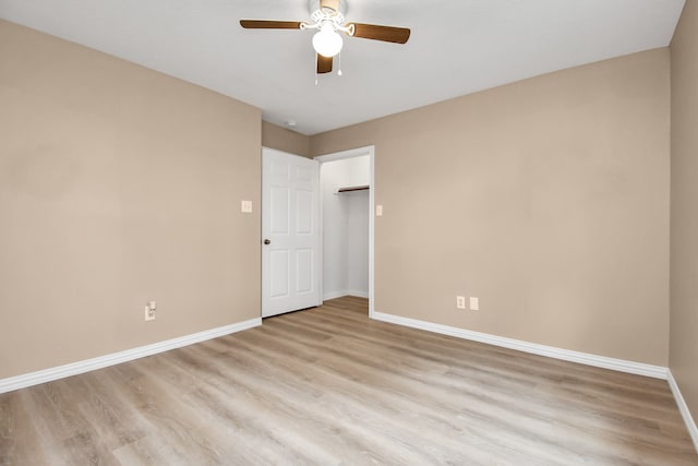 empty room with light hardwood / wood-style floors and ceiling fan