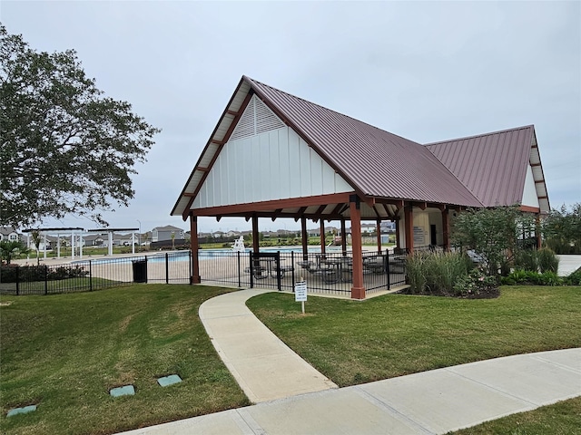 view of property's community with a yard, a swimming pool, and a gazebo