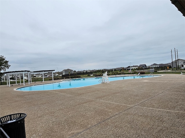 view of swimming pool with a patio