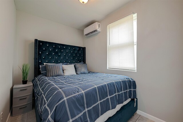 1585 Rd 5734, Cleveland, TX 77327 - tiled bedroom with a wall mounted air conditioner and baseboards