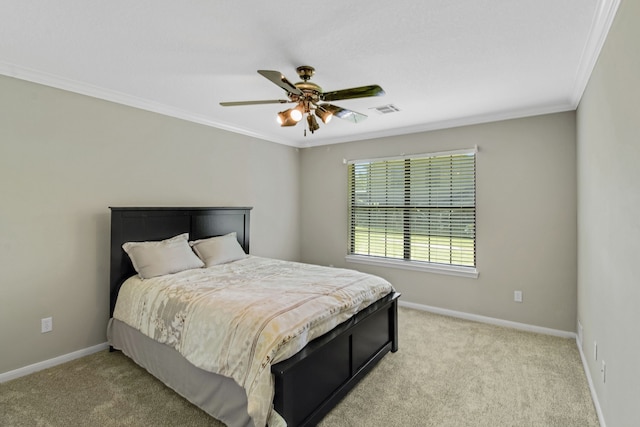 carpeted bedroom with crown molding and ceiling fan