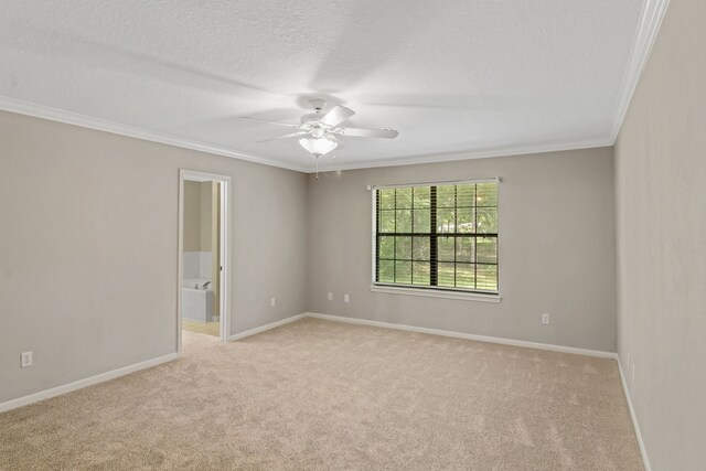 unfurnished room with crown molding, a textured ceiling, light colored carpet, and ceiling fan